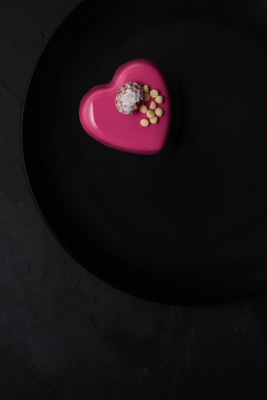 Heart cake on black plate