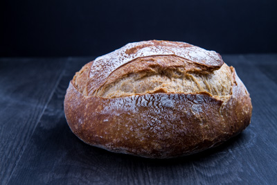 Ball of Bread on wood dark