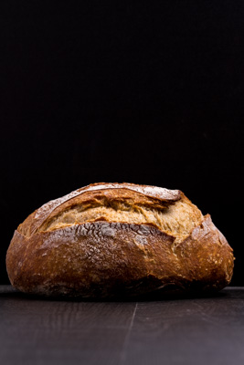 Ball of Bread on wood dark